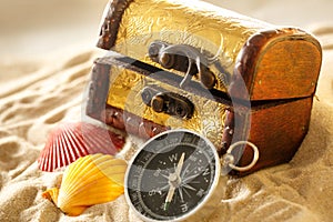 Treasure chest with seashells and compass