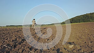 Treasure hunter with a metal detector looking for treasure