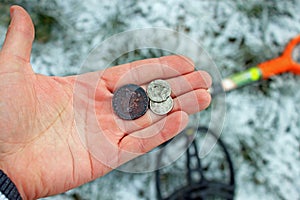 Treasure hunter. Searching with metal detector.