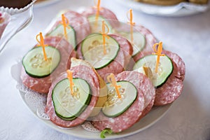 Treat on the table made of bread and sausage.