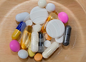 Treatment. Assortment of pharmaceuticals, many tablets and capsules.