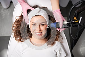 Treatment of facial skin imperfections with laser resurfacing. photo