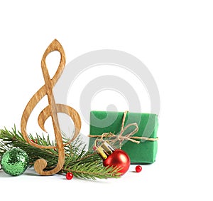 Treble clef with decorations  on white. Christmas music concept