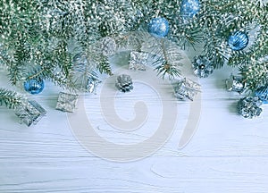 Tree branch, ball design seasonal on white wooden background, snow