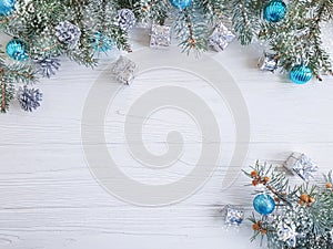 Tree branch, ball gift decorate december frame seasonal decorative on white wooden background, snow