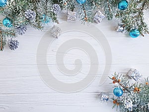 Tree branch, ball gift decorate december frame seasonal decorative on white wooden background, snow photo