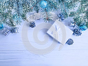 Tree branch, ball gift design seasonal decorative on white wooden background, snow