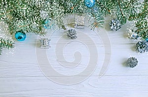 Tree branch, ball gift design seasonal on white wooden background, snow