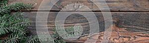 Tree branch on rustic wooden background used for christmas decoration