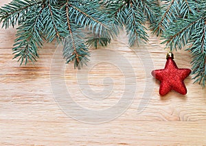 Tree branches with stars on wooden board