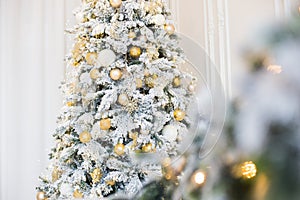 Tree and Christmas decorations. Beautiful decorated with present boxes in a winter landscape with snow.