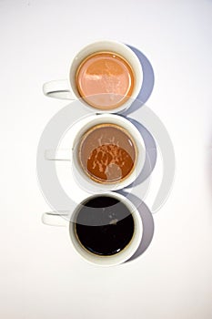 Tree cups with different types of coffee