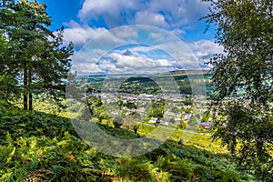 A tree framed view from Ilkley moor above the town of Ilkley Yorkshire, UK photo