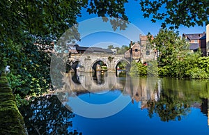 A tree framed view towards the Elvet Bridge in Durham, UK photo