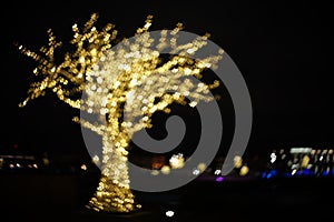 Tree of golden big and small hearts bokeh. Beautiful valentines day background