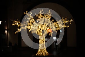 Tree of golden dollar lights. Abstract financial background with many dollar symbols