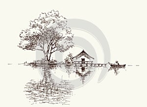 Tree, house and boat on lake shore