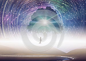 Tree of knowledge, girl silhouette, cosmos, spinning stars sky