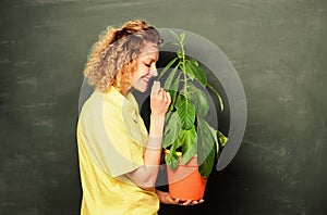 Tree of life. teacher woman in glasses at biology lesson. school nature study. happy student girl with plant at