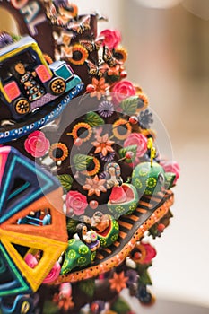 Tree of life with traditional Mexican toys made of clay