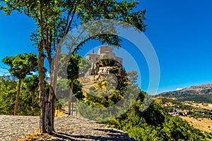 A tree lined path zigzags up to the Church of Saint Maria in the hilltop village of Petralia Soprana in the Madonie Mountains