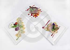 Tree plates of fine dining meal