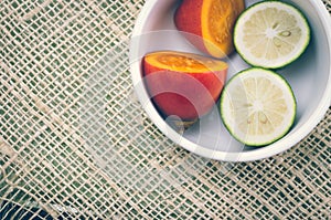 Tree tomato and limes cut in halfs inside white