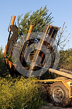 Tree transplanter heavy machine. machine for transplanting large trees. photo