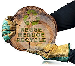 Tree Trunk with a Recycle Symbol and Text Reuse Reduce Recycle