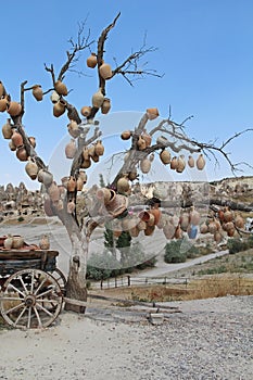 Tree Of Wishes with clay pots in Cappadocia. Goreme, Nevsehir Province, Cappadocia, Central Anatolia, Turkey