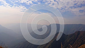 Treeless mountain range covered at morning from flat angle clip showing the beautiful natural landscape of hill range timelapse