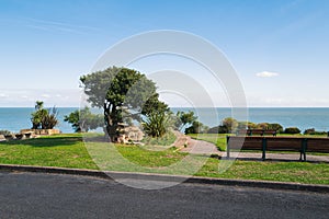 Trees and benches along the promenade of the East Cliff, in the seaside town of Ramsgate, Kent, UK