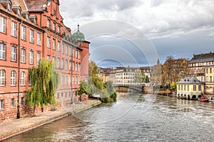 Trees and bridge on a canal in Strasbourg, France