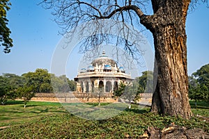 Trees frame the Isa Khans Garden Tomb, part of Humayan`s Tomb