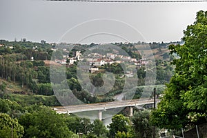 Trees leaves and bridge of IP3 highway over DÃ£o river, Santa Comba DÃ£o PORTUGAL photo