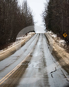 Glenn Hwy highway before a snowstorm close to Eagle River on the way to Matanuska glacier from Anchorage, in Alaska. Winter time