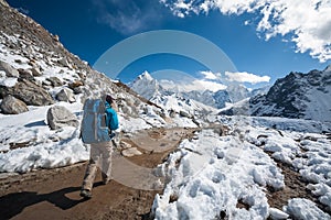 Trekker approaching Amadablan mount in Khumbu valley on a way to