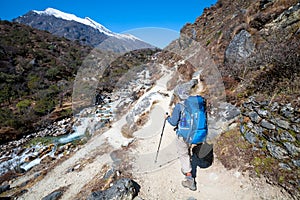 Trekker approaching Renjo La pass on a way to Everest Base camp