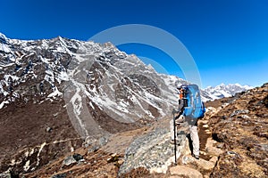 Trekker approaching Renjo La pass on a way to Everest Base camp