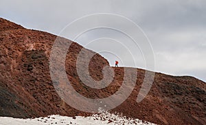 Trekker ascending Modi mountain during Fimmvorduhals trek in Iceland