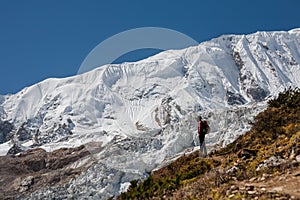 Trekker in front of Manaslu glacier on Manaslu circuit trek in N