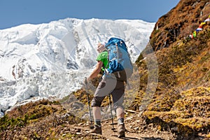 Trekker in front of Manaslu glacier on Manaslu circuit trek in N