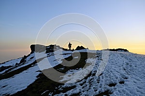 Trekker in Himalaya,Leader leading the pack to the destination with sunset in the backdrop