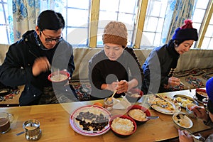 Trekker rest for food in lodge cabin from everest trek