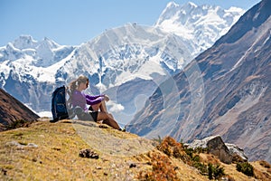 Trekker rests on Manaslu circuit trek in Nepal