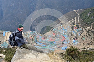 Trekker sitting above Namche Bazaar town,Nepal.Asia