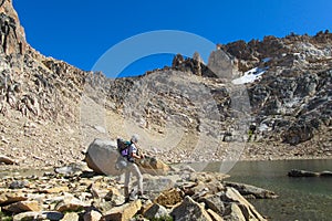 Trekker tourist in roky mountains