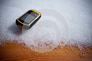 A trekker using a gps during his trip in the mountain