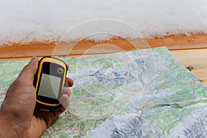 A trekker using a gps during his trip in the mountain