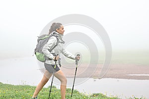 Trekker walking a foggy day in the mountain